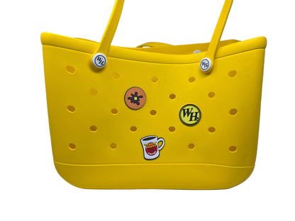 Yellow bag with a waffle, coffee mug, and WH circle logo bag gibbets