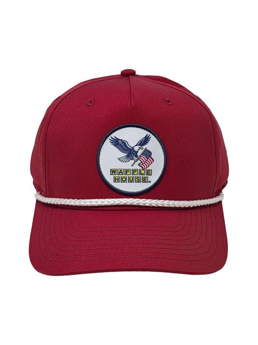 Red cap with a logo featuring an eagle and American flag on a white background