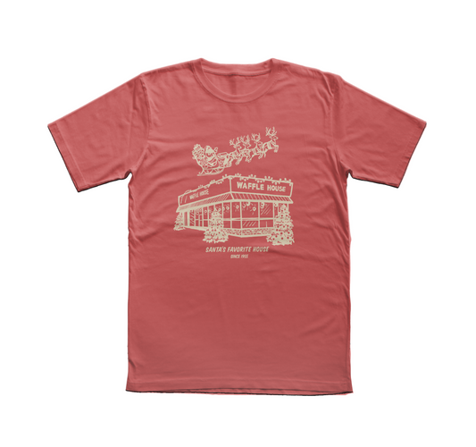 Red T-shirt featuring a cream-colored drawing of Santa and his reindeer flying over a snowy Waffle House with the words “Santa’s Favorite House Since 1955.