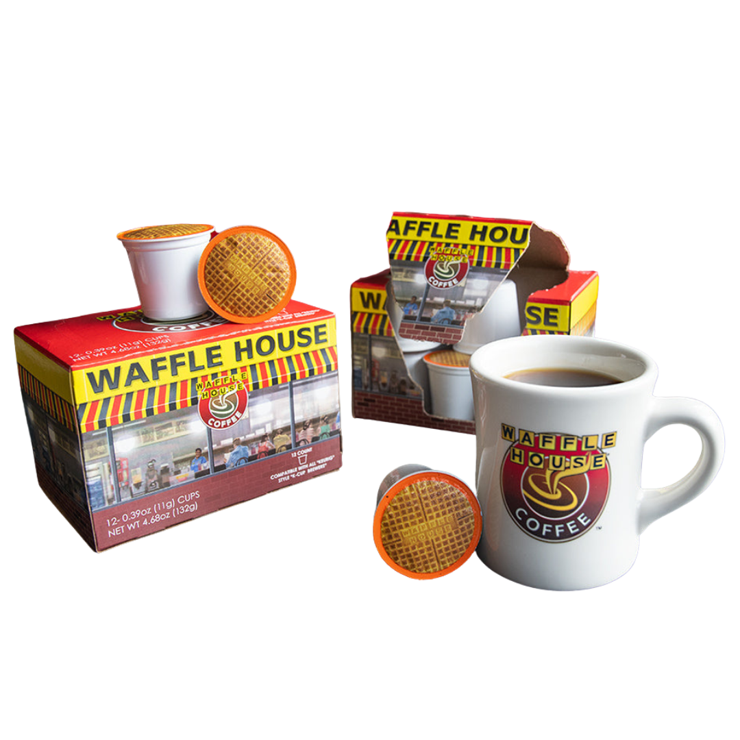 2 boxes of Waffle House coffe pods sitting on the table of a booth with a cup of coffee in a Waffle House mug