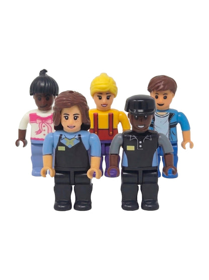 Five smiling toy mini-figures stand together, including two restaurant workers in dark uniforms in front and three casually dressed characters behind them.