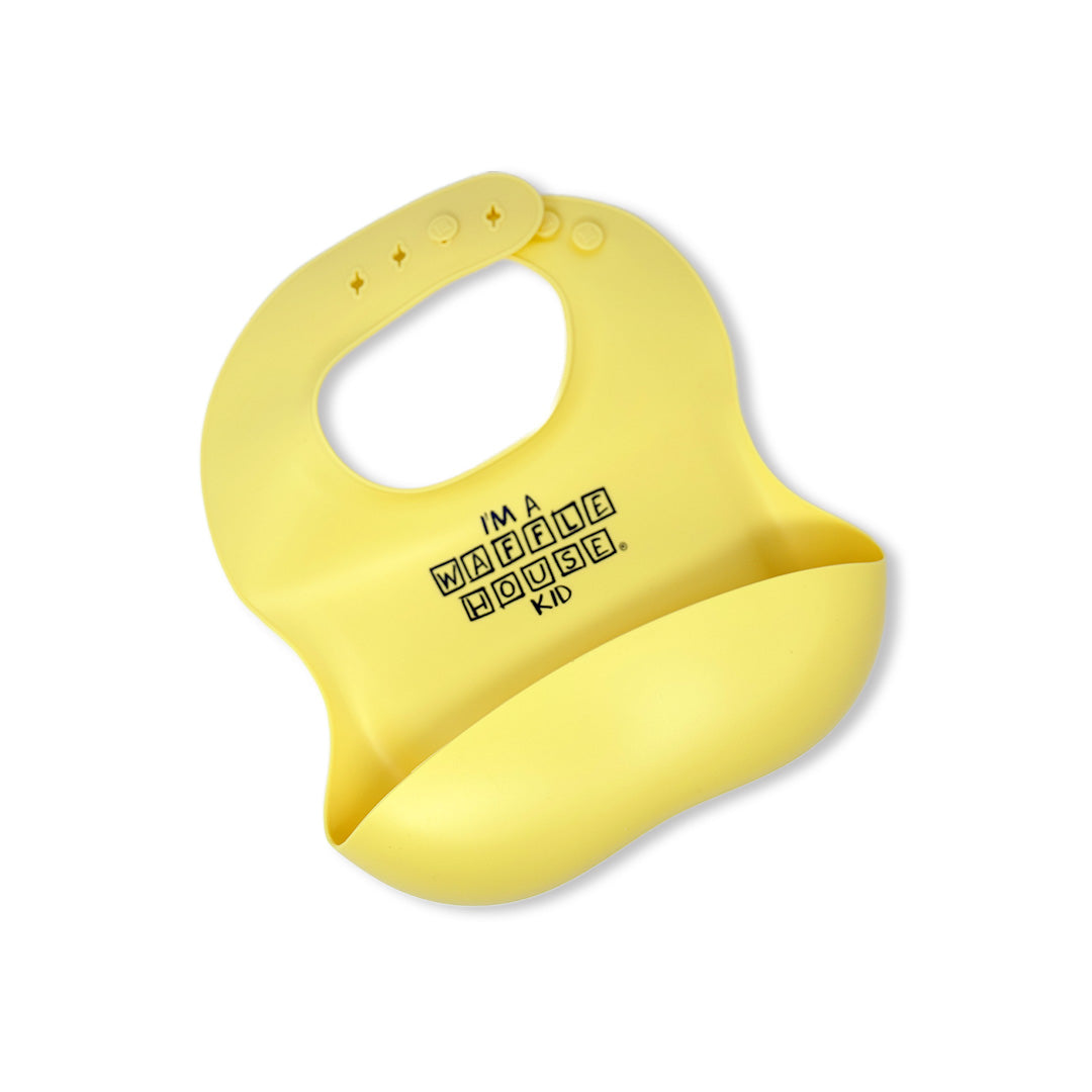 yellow silicone baby bib with I'm a Waffle House kid on the front in black