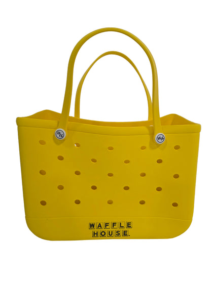 Yellow tote bag with perforated design and 'Waffle House' branding on a white background