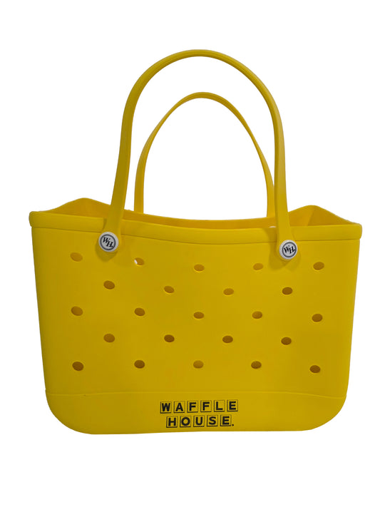 Yellow tote bag with perforated design and 'Waffle House' branding on a white background