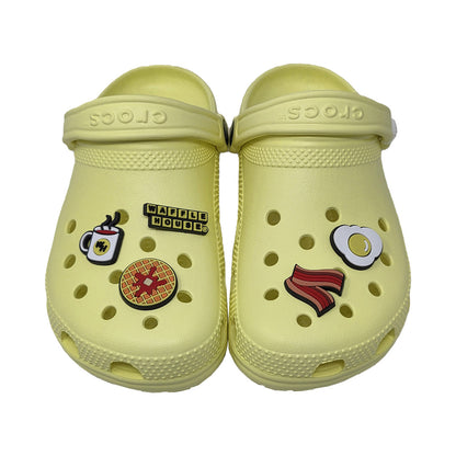 Pair of light yellow clogs with waffle house themed shoe charm