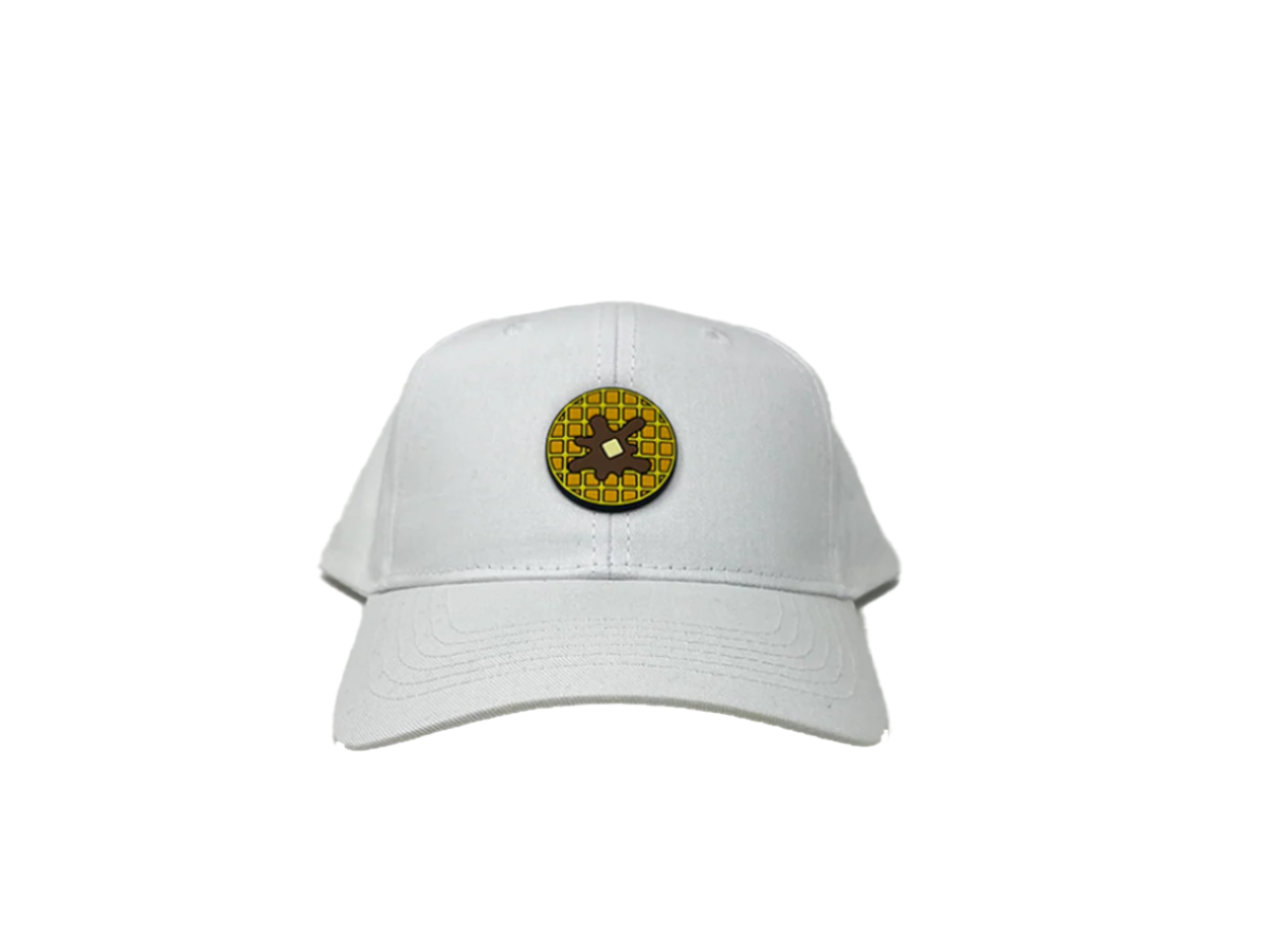 White cap with a circular logo featuring a yellow circle and black design on a white background