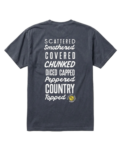 A dark gray T-shirt with large white text on the back listing Waffle House hashbrown styles like scattered, smothered, covered, chunked, diced, capped, peppered, country, and topped.