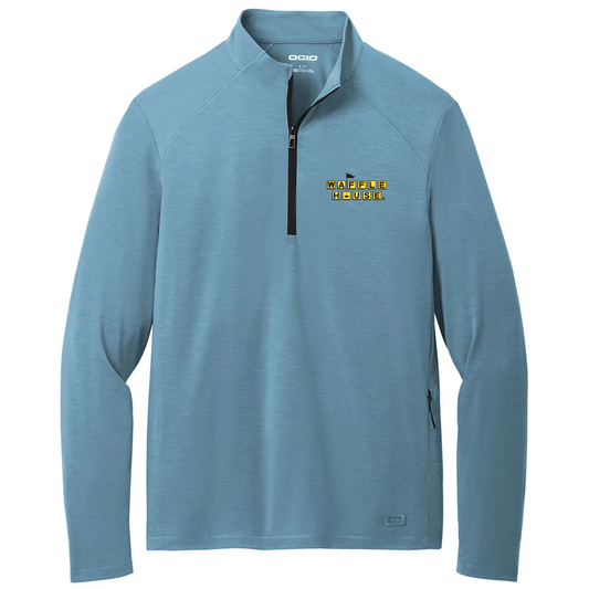 Heathered blue OGIO quarter-zip pullover with an embroidered Waffle House golf logo in yellow on the left chest. Features a black zip placket and a side zip pocket.