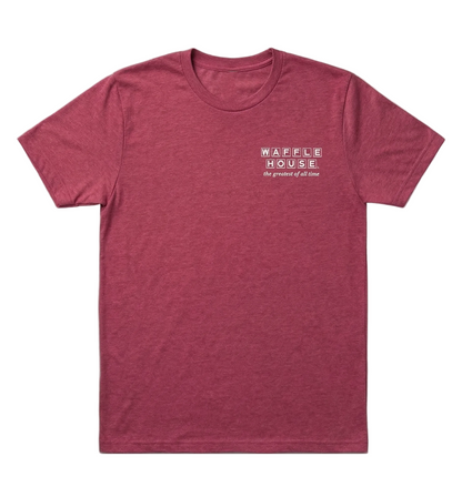 A red short-sleeve T-shirt with a small white Waffle House logo on the left chest that reads “the greatest of all time.”