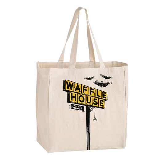 Beige canvas tote bag featuring a Halloween-themed Waffle House sign graphic with bats flying above and a spider hanging from the sign, along with the text 'Spooky Season' at the bottom.