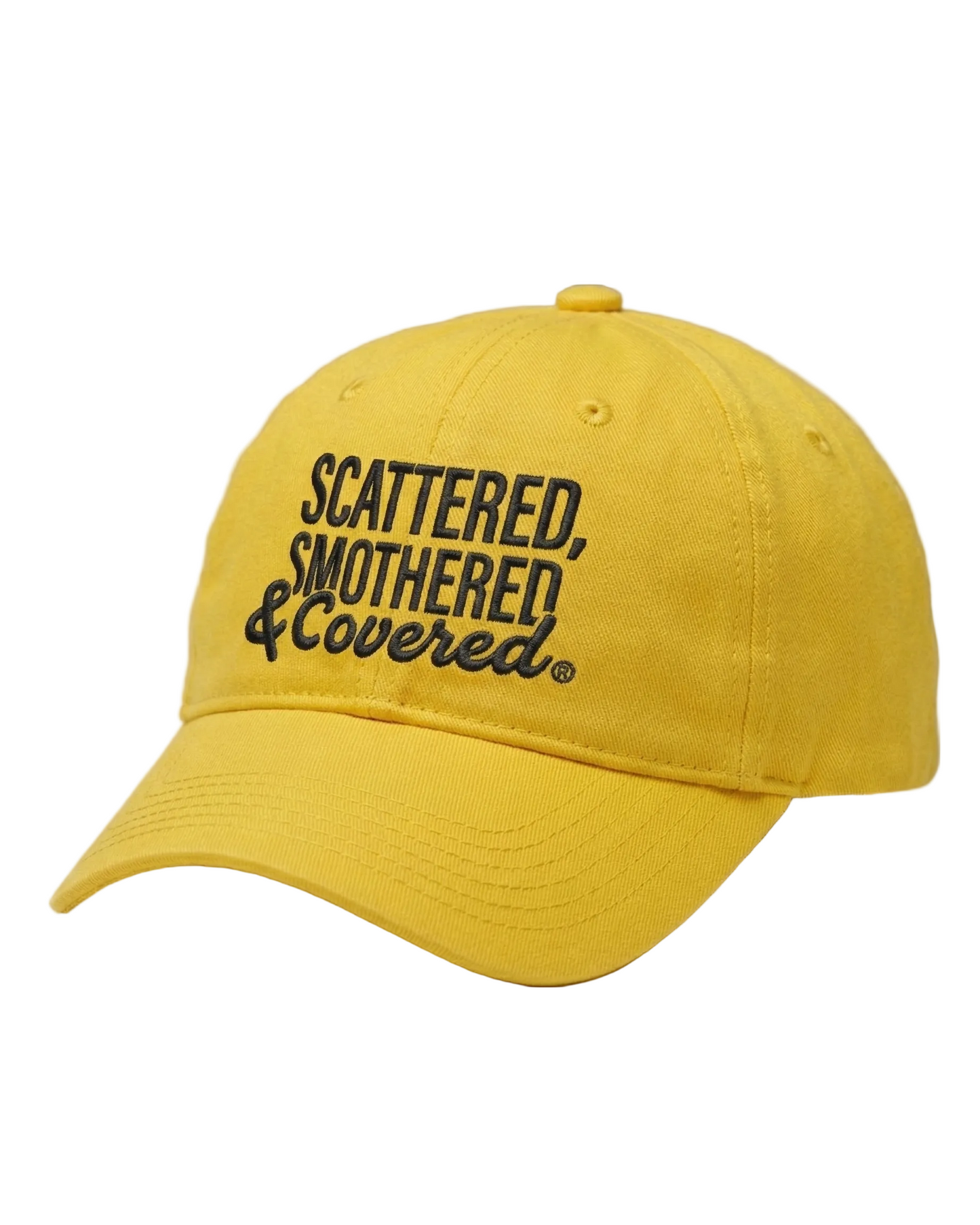 A bright yellow baseball cap with black embroidered text reading “Scattered, Smothered & Covered.”
