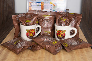 Ten bags Waffle House ground coffee and two Waffle House classic mugs.